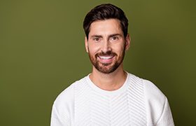 a man smiling with beautifully brightened teeth